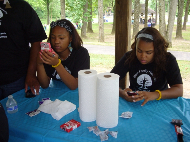 Shamauria and Kennedie buried in their phones.